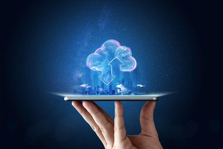Hand holding a digital tablet with a glowing cloud icon representing AI-powered cloud ERP and machine learning for business automation, set against a futuristic cityscape background.